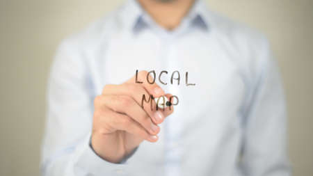 Local Map, man writing on transparent screenの写真素材