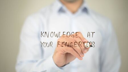 Knowledge At Your Fingertips, writing on transparent screenの写真素材