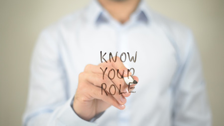Know Your Role   ,  man writing on transparent wallの写真素材