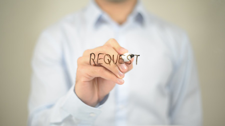 Request, man writing on transparent screenの写真素材