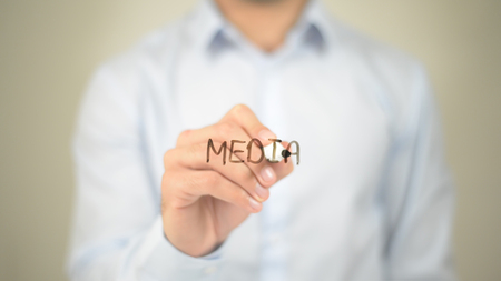 Media, Man writing on transparent screenの写真素材