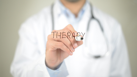 Therapy, Doctor writing on transparent screenの写真素材