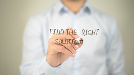 Find The Right Solution , man writing on transparent screenの写真素材