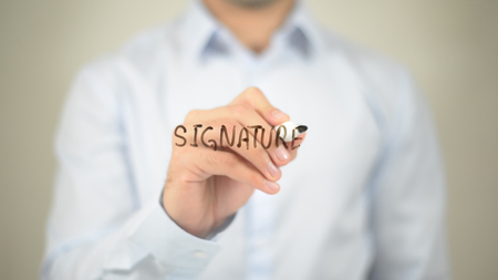 Signature, writing on transparent screenの写真素材