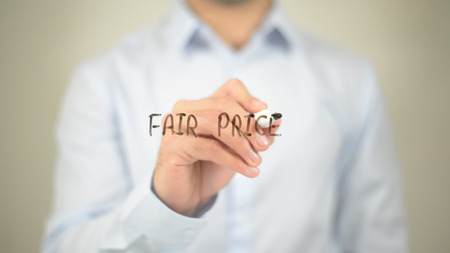 Fair Price   ,  man writing on transparent wallの写真素材