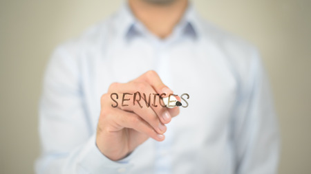 Services,  Man writing on transparent screenの写真素材