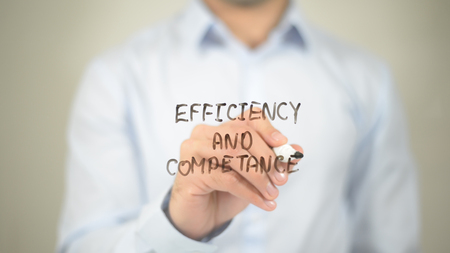 Efficiency And Competance    ,  man writing on transparent wallの写真素材
