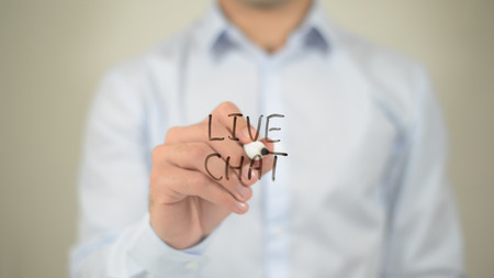 Live Chat , man writing on transparent screenの写真素材