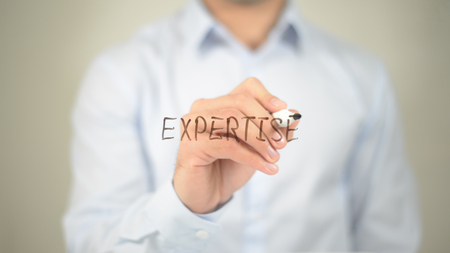 Expertise, man writing on transparent screenの写真素材