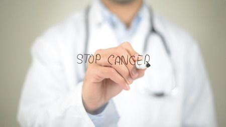 Stop Cancer, Doctor writing on transparent screenの写真素材