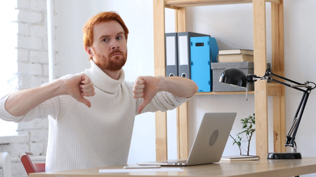 Thumbs Down by Man with Red Hairsの写真素材