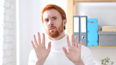 Rejecting Offer, Denying Man with Red Hairsの写真素材