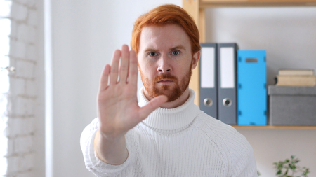 Stop Sign, Man with Red Hairs  Gesturing with Handの写真素材
