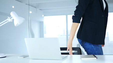 Femlae Worker leaving Office after Completing Jobの写真素材
