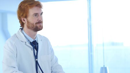 Positive Relax Doctor Sitting in Clinic, Surgeonの写真素材