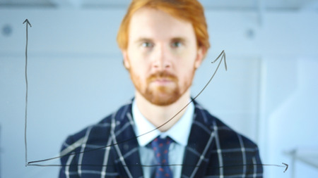 Looking in Camera, Growth Graph on Transparent Glass in Office, Red Hairsの写真素材