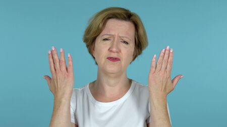 Old Woman Gesturing Failure and Problems Isolated on Blue Background