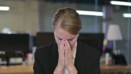 Portrait of Cheerful Young Businesswoman doing OK Signの写真素材