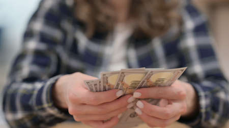 Female Hand Counting Dollars, Close upの写真素材