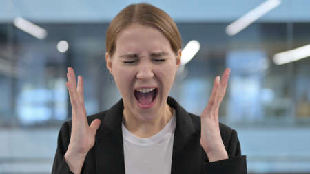 Portrait of Attractive Businesswoman Screaming, Shoutingの写真素材