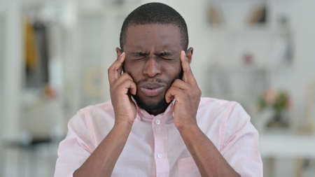 Portrait of Stressed African Man having Headacheの写真素材