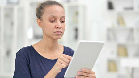 Portrait of African Woman using Digital Tabletの写真素材