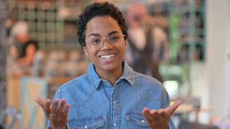 Portrait of Beautiful African Woman doing Video Chatの写真素材