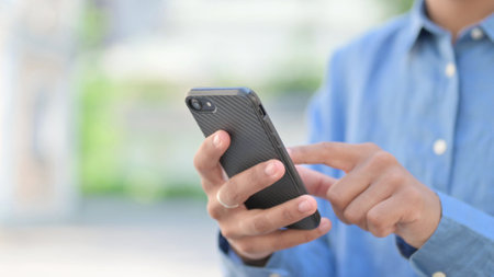 Hands Close Up of African Woman using Smartphone