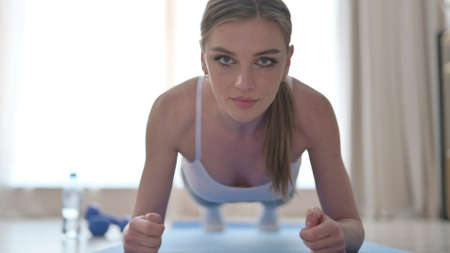 Close Up of Woman doing Planks on Yoga Mat at Home