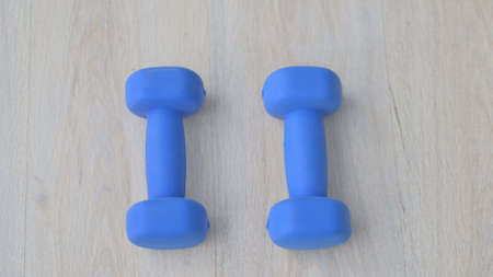 Close up shot of Blue Dumbbells on Floorの写真素材