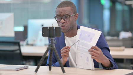 Young African Businessman Recording Video On Cameraの写真素材