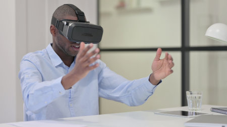 African Man using VR Glasses for Virtual Reality Experience