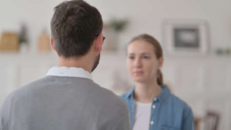 Couple Standing and Hugging at Homeの写真素材
