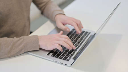Hands Close Up of Man Typing on Laptop