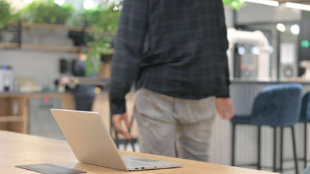 African American Man Going Away from Office