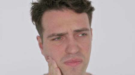 Face Close Up of Young Man with Toothacheの写真素材
