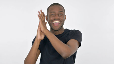 Happy Young African Man Applauding on White Background