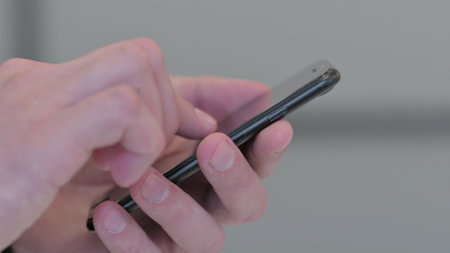 Close up of Middle Aged Businessman Typing on Smartphone, Mobile