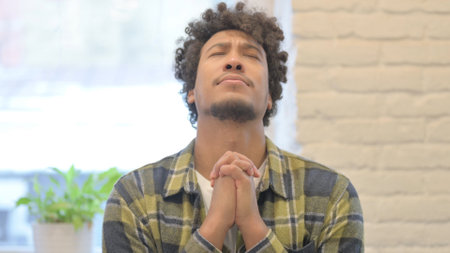 Praying Young African Man Wishing to God