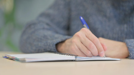 Close up of Man Writing a Letterの写真素材