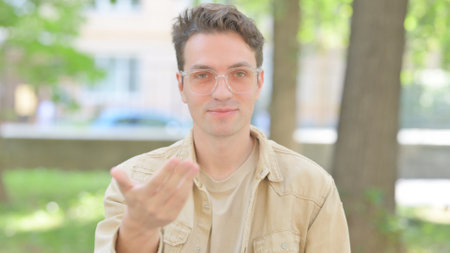Outdoor Portrait of Inviting Casual Young Manの写真素材