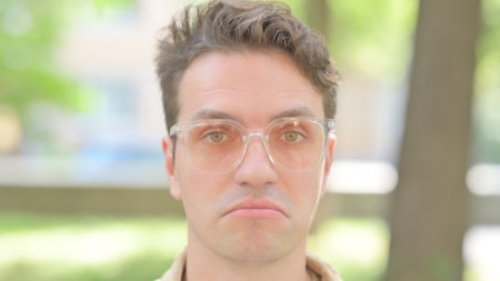 Face Close up of Shocked Young Man Outdoorの写真素材