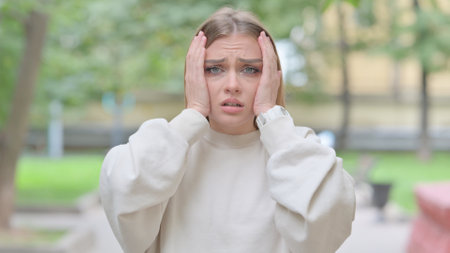 Outdoor Portrait of Woman Reacting to Failureの写真素材