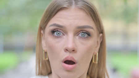 Face Close up of Shocked Woman Outdoorの写真素材