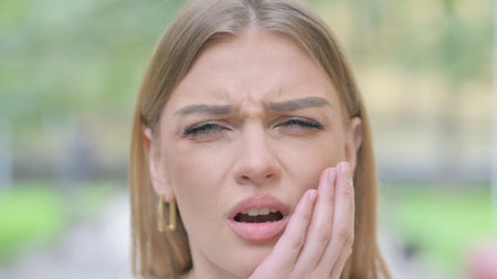 Face Close up of Woman with Toothacheの写真素材