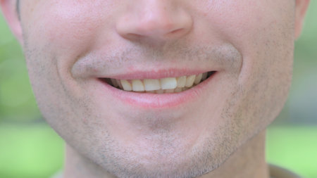 Close up of Smiling Young Man Mouthの写真素材