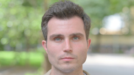 Close up of Serious Young Man Face Outdoorの写真素材