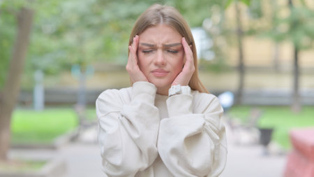 Outdoor Portrait of Woman with Migraineの写真素材