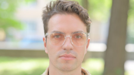 Face Close up of Serious Young Man Outdoorの写真素材