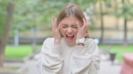 Angry Woman Arguing and Screaming Outdoorの写真素材